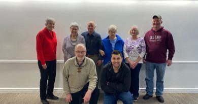A group of people pose for a photo.