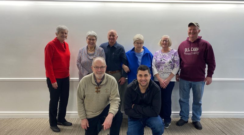 A group of people pose for a photo.