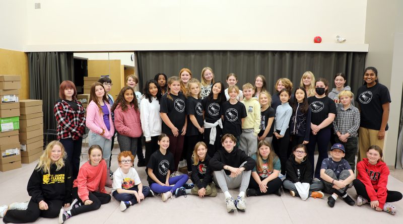 A group photo of a theatre troupe.