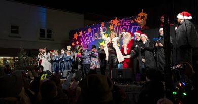 A photo of people celebrating on a stage.