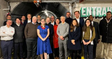 A group poses for a photo.