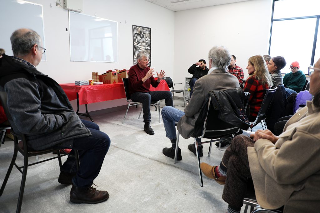 A group of people chat.