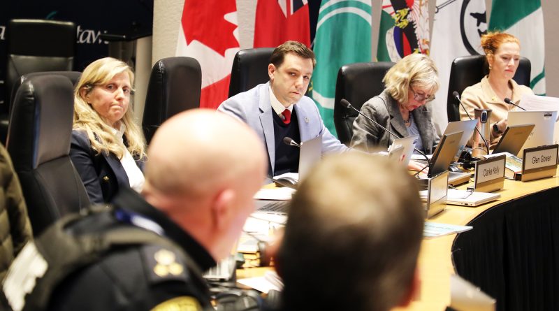 A councillor asks questions of a police chief.