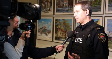 A police officer talks to the media.