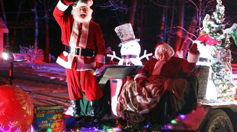 Santa waves from a float.