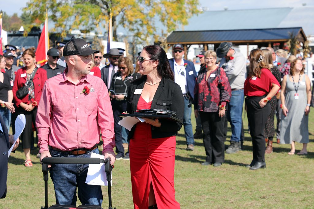Two people speak during the opening ceremonies of the Carp Fair.