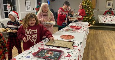 Galetta Cookie exchange swaps sweets A woman fills a box with cookies.
