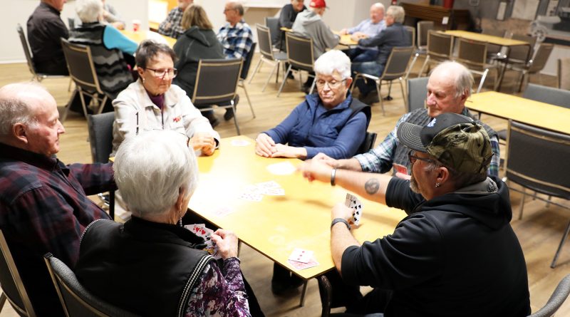 A photo of people playing euchre.