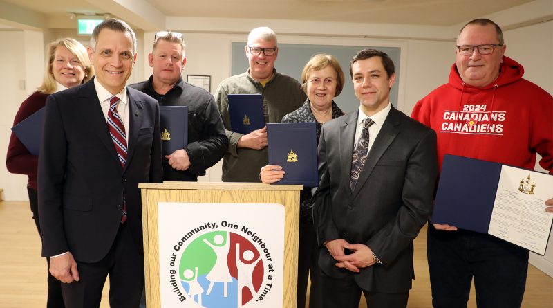 A group of people pose for a photo.