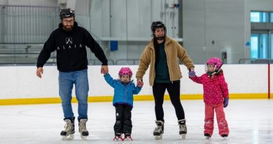 A photo of a family skating.