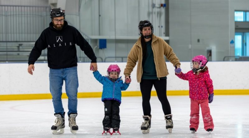 A photo of a family skating.