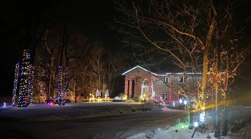 A photo of a house adorned with Christmas lights.