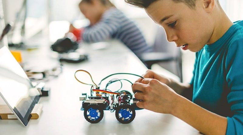 A photo of a kid working on a project.