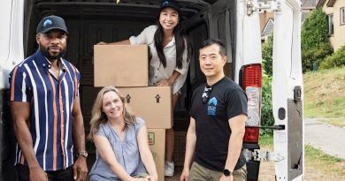 Shelter Movers moves changing lives A group poses for a photo in front of a moving van.