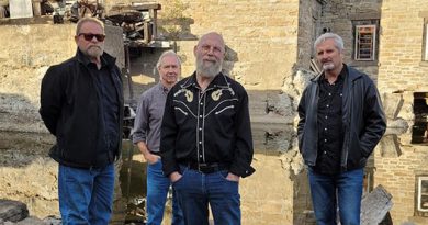 A band poses for a photo.