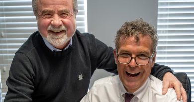 Two people pose for a photo.