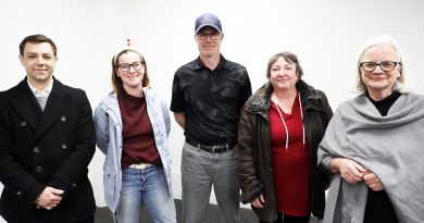 A group of people pose for a photo.