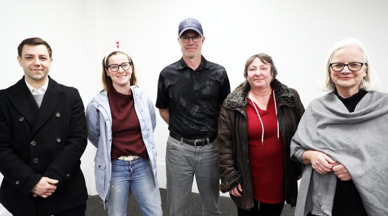A group of people pose for a photo.