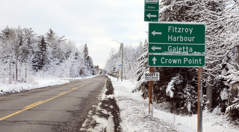 A photo of a snowy road.