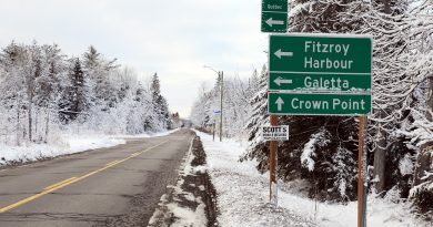 A photo of a snowy road.
