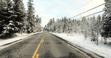 A photo of a snowy road.