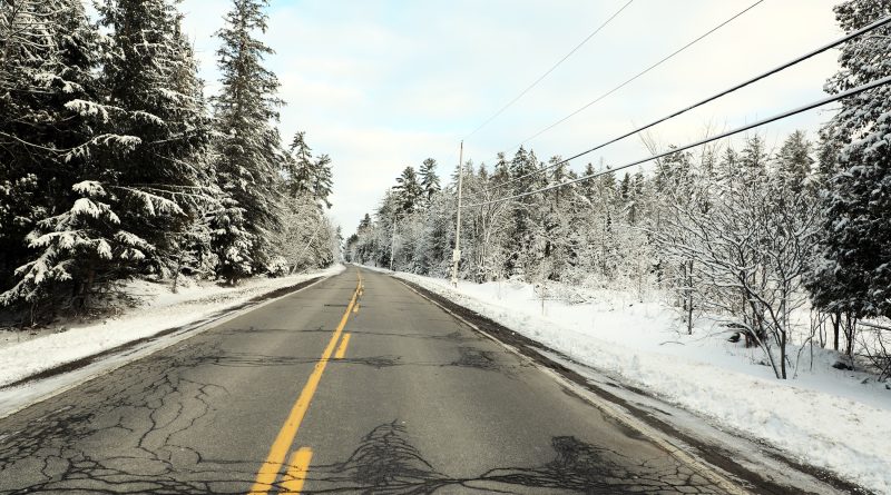 A photo of a snowy road.