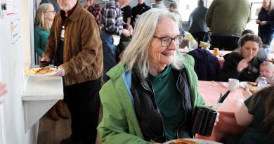 Galetta spring breakfast jam-packed Community members get breakfast from a serving window.