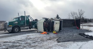 A photo of a flipped over truck.