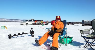 Mike, Pete’s derby biggest, windiest ever A young boy fishes the Ottawa River hard water.