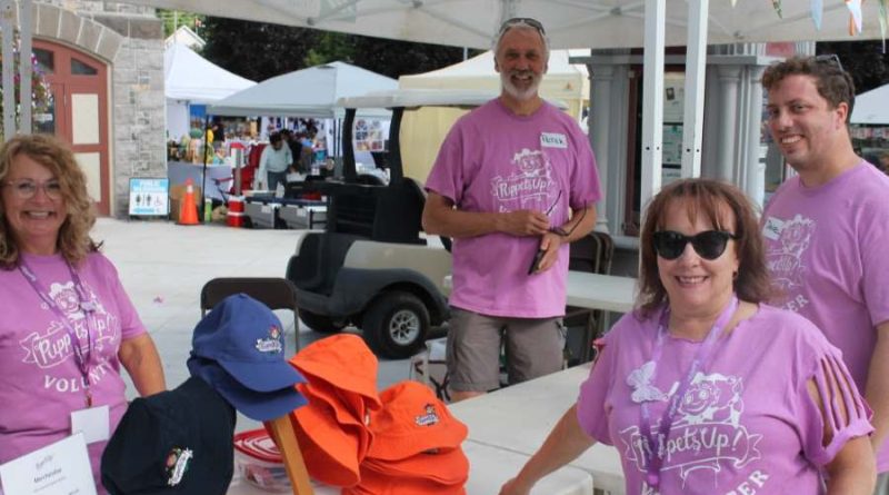 A group of volunteers pose for a photo.