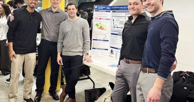 A group pose for a photo.