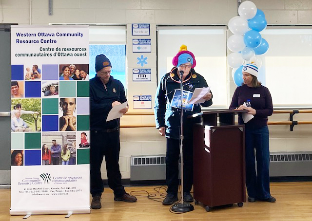 A person speaks at a podium.