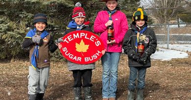 1st Carp Scouts offering sweet deal Four scouts pose with syrup.