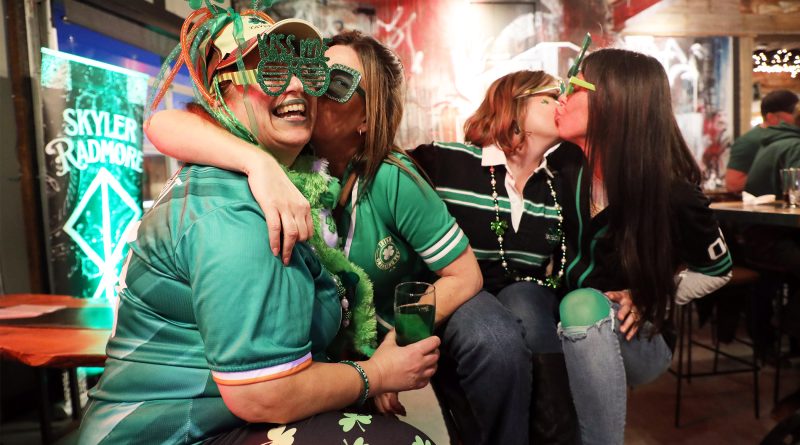 Four people pose for a photo.