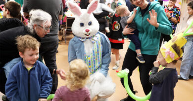 Two hundred C Bay kids find 6,000 eggs A photo of kids gathered around the Easter Bunny.
