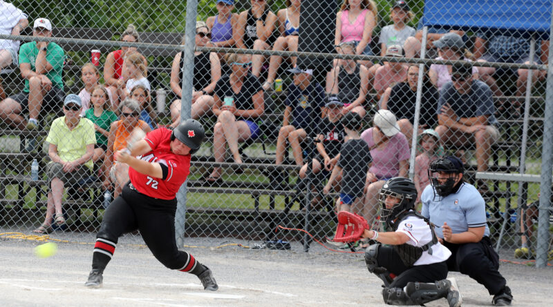 An ump makes a call during a fastball game.