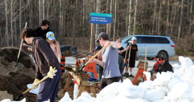 Youth fill sandbags.
