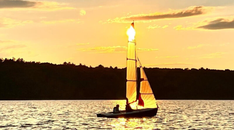 A photo of a boat sailing on the river.