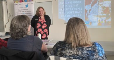 A woman speaks to an audience.