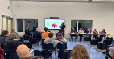 A photo of a meeting in a board room.
