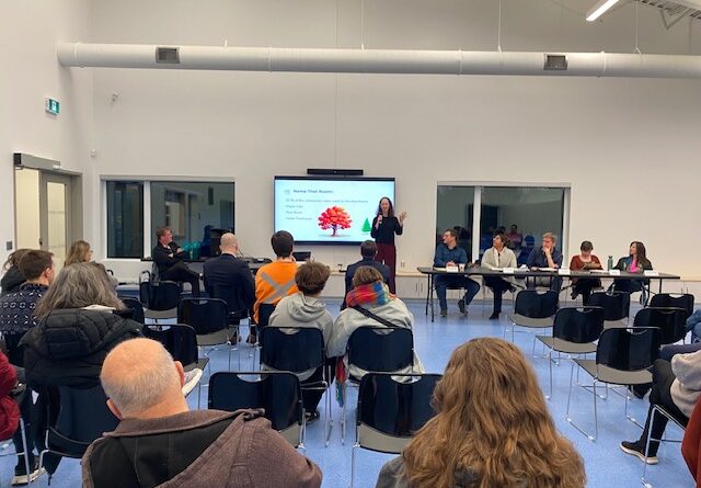 A photo of a meeting in a board room.
