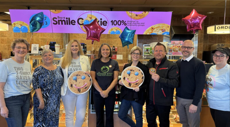 People pose for a photo.