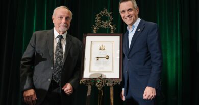 Two people pose for a photo.