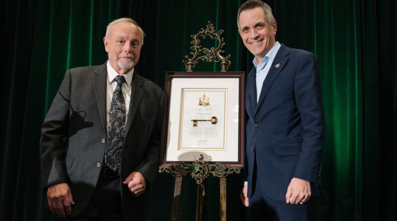 Two people pose for a photo.