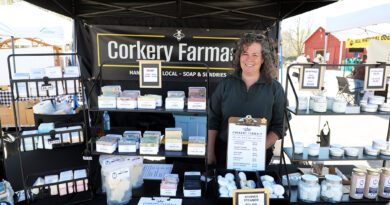 Carp Farmers’ market makes sunny debut A woman poses in a vendor's booth.