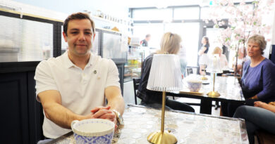 A man has a coffee at the Skylark Cafe.