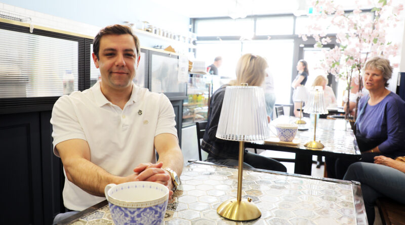 A man has a coffee at the Skylark Cafe.
