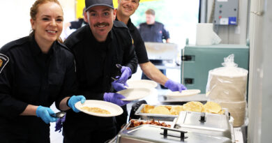 WC firefighters host breaky all weekend Three firefighters serve breakfast.
