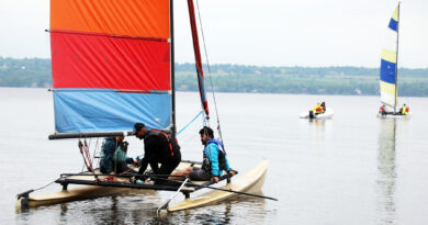 Two sailboats head out on to the Ottawa River.