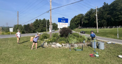A photo of people gardening.